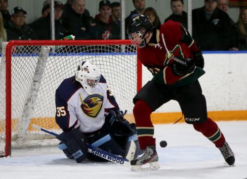 Winnipeg Wild Ryan Pruden tries to deflect a shot past Winnipeg Thrashers' Troy Martyniuk during the AAA Midget Championships, Sunday, March 24, 2013. The Wild went on to win in double overtime. (TREVOR HAGAN/WINNIPEG FREE PRESS)