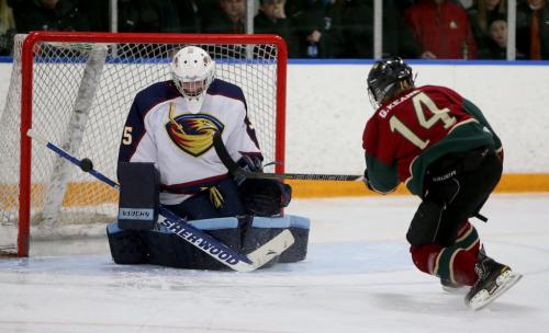 Winnipeg Thrashers' goaltender, Troy Martyniuk, stops a puck fired by Winnipeg Wild's, Geordie Keane, during the AAA Midget Championships, Sunday, March 24, 2013. The Wild went on to win in double overtime. (TREVOR HAGAN/WINNIPEG FREE PRESS)