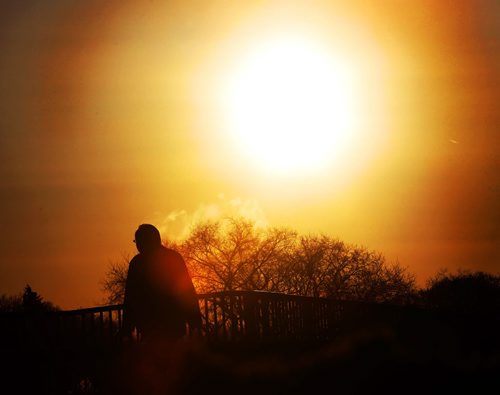 Bring on the Sun- A man walks over the Arlington St bridge as the sun rises in Winnipeg Tuesday morningstandup photo- March 26, 2013   (JOE BRYKSA / WINNIPEG FREE PRESS)