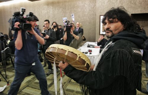 Protester who goes by the name Dancing Bear disrupts the announcement where the Honourable Bernard Valcourt Minister of Aboriginal Affairs and Northern Development spoke in Winnipeg saying that Bill C-27, the First Nations Financial Transparency Act reached Royal Assent and became law today.  130327 March 27, 2013 Mike Deal / Winnipeg Free Press