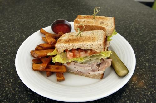 Terry Proveda  is sampling  every clubhouse sandwich in Wpg he is at the Metropolitan Centre , at the Met restaurant  with sandwich   - Detour  Äì by Dave Sanderson Äì  KEN GIGLIOTTI / Mar. 27 2013 / WINNIPEG FREE PRESS