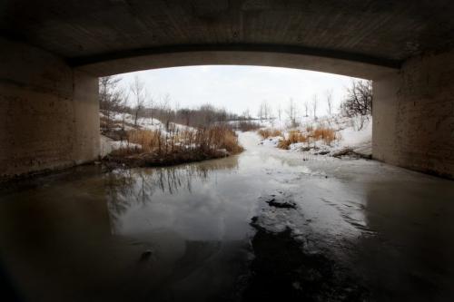 Picturesque view of Omands Creek melting under the Portage bridge overpass Thursday afternoon. Standup Photo Photography by  Ruth Bonneville /  Winnipeg Free Press)