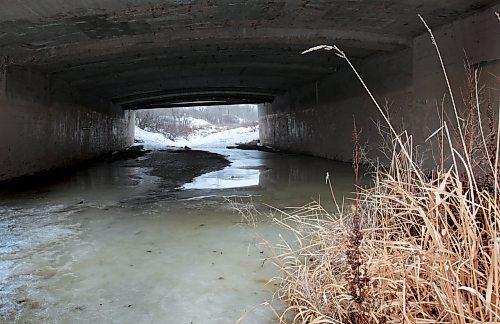 Picturesque view of Omands Creek melting under the Portage bridge overpass Thursday afternoon. Standup Photo Photography by  Ruth Bonneville /  Winnipeg Free Press)