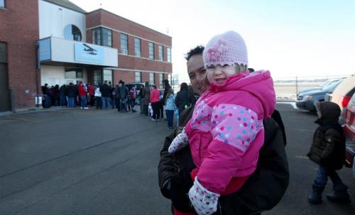 Three year old Chloe Yuen stands line with her dad outside the Candian Aviation Museum waiting for the doors to open for their annual Easter Egg Hunt Saturday morning. Standup Photo Photography Ruth Bonneville  Ruth Bonneville /  Winnipeg Free Press)