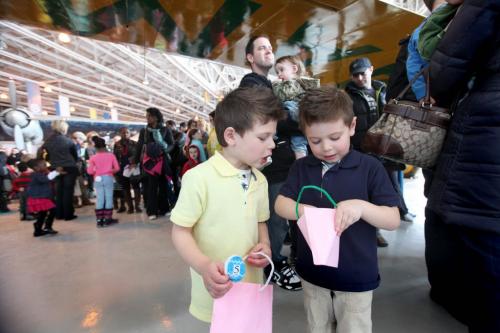 The Western Canadian Aviation Museum was host to hundreds of little egg hunters of all ages Saturday morning for their  annual Easter Egg Hunt. Brothers Ethan Salemi - 5 years (yellow) and Liam - 4yrs check out each others paper egg collection while waiting in line to turn them in for real chocolate eggs. Standup Photo Photography Ruth Bonneville  Ruth Bonneville /  Winnipeg Free Press)