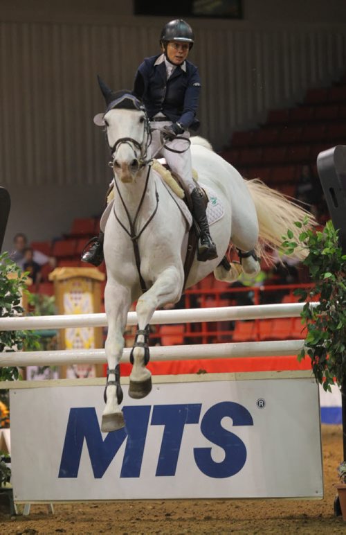 Brandon Sun Karen Cudmore, on Ceonto, went clear and fast to win the the MTS Grand Prix at the Royal Manitoba Winter Fair on Saturday night at Westman Place. (Bruce Bumstead/Brandon Sun)