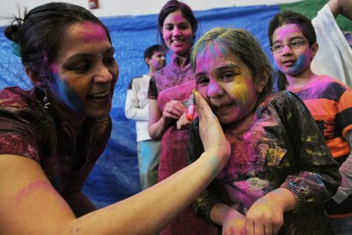 Shweta Banthia and her daughter Van, 4, observe Holi, a religious spring festival celebrated by Hindus as a festival of colours at the Dr. Raj Pandey Hindu Centre Sunday afternoon.  130330 March 30, 2013 Mike Deal / Winnipeg Free Press