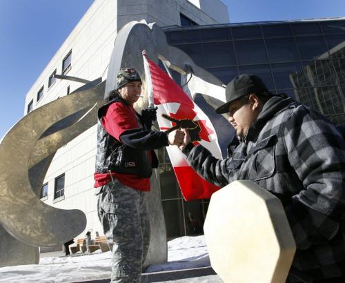 At right, Northwind Hart and Kylo Prince in front of the Law Courts Bld. Tuesday morning  in support of the Moose family who will be attending the hearing to determine who can participate at the inquest into the death of a Headingley Correctional Centre inmate who died in October 2009 at Grace General Hospital. Donald Ray Moose, 32, was taken to hospital by ambulance when jail staff noticed he was disoriented, had trouble breathing and didn't fully respond to glucose for his diabetes.    (WAYNE GLOWACKI/WINNIPEG FREE PRESS) Winnipeg Free Press April 2 2013