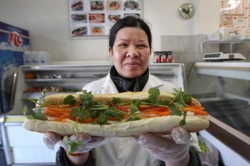 Tran Cuc Thi holds Banh Mi (cold cut ) sub from Khanh Hoa  698 SargentSee Marions restaurant review  April 02, 2013   (JOE BRYKSA / WINNIPEG FREE PRESS)