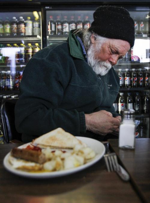 Ice fisherman Frank Kenyon reflects on the day's upcoming activities over breakfast at the Fairford Bridge Convenience store and restaurant in Fairford, Man. on Tuesday, March 26, 2013. (REPORTER: BARTLEY KIVES) (JESSICA BURTNICK/WINNIPEG FREE PRESS)