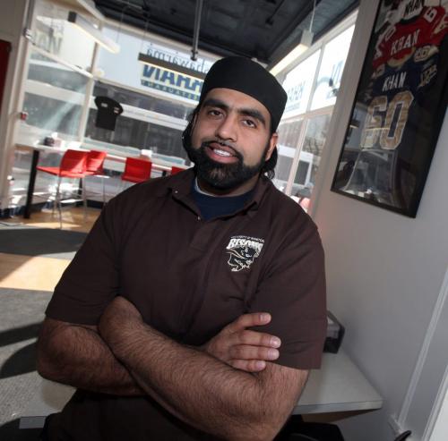 Obby Khan poses in his Market Square area restraunt Tuesday. THe Bomber is now joining the coaching staff at U of M. See story. April 2, 2013 - (Phil Hossack / Winnipeg Free Press)