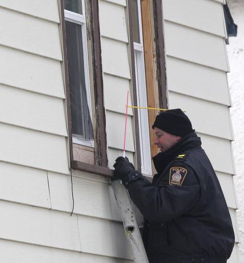Winnipeg Police identification officers gather evidence from Tuesday afternoon homicide scene in the 500 block of Langside St Wednesday afternoon standup photo- April 03, 2013   (JOE BRYKSA / WINNIPEG FREE PRESS)