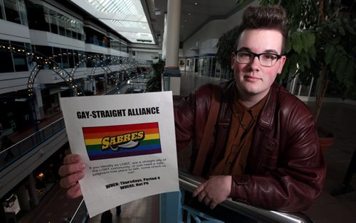 Evan Wiens holds up the poster he will now be allowed to distribute promoting the "Sabres" Gay Straight Alliance in Steinbach. See Nick Martin's story.  April 3, 2013 - (Phil Hossack / Winnipeg Free Press)