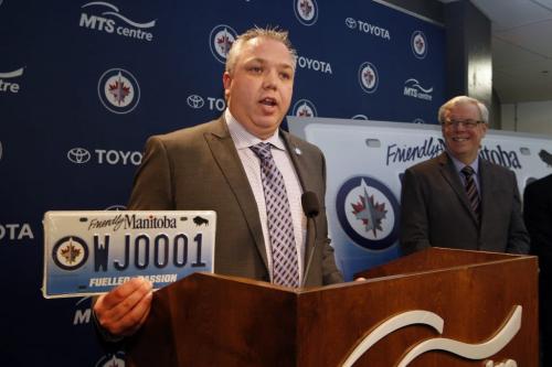 Wpg Jets True North Foundation executive director (left) Dwayne Green   and the Man. Gov. Premier Greg Selinger  announce the raffle of  the first printed  Jets specialty licence plate # WJ0001 . The  tickets are $20 each with all proceeds going to WJTNF .  The run of Jets plates were put on sale in 2011 , with the first plate being held for  the lottery prize .These plates were released to the public Dec. 12 2011 with some of the money going to WJTNF .Premier Selinger also brought a check for 809,580  from MPI and the Gov. Of MB. As proceeds from the sale of 27,000 Jets licence plates.  KEN GIGLIOTTI / April . 4 2013 / WINNIPEG FREE PRESS