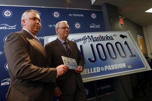 Wpg Jets True North Foundation executive director (left) Dwayne Green   and the Man. Gov. Premier Greg Selinger  announce the raffle of  the first printed  Jets specialty licence plate # WJ0001 . The  tickets are $20 each with all proceeds going to WJTNF .  The run of Jets plates were put on sale in 2011 , with the first plate being held for  the lottery prize .These plates were released to the public Dec. 12 2011 with some of the money going to WJTNF .Premier Selinger also brought a check for 809,580  from MPI and the Gov. Of MB. As proceeds from the sale of 27,000 Jets licence plates.  KEN GIGLIOTTI / April . 4 2013 / WINNIPEG FREE PRESS