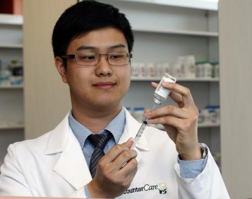 Pharmacist Than Nguyen operates the CinDen  Pharmacy , phramacists are looking to provide  inoculation service  like flu and travel shots .Larry Kusch story  KEN GIGLIOTTI / April . 4 2013 / WINNIPEG FREE PRESS