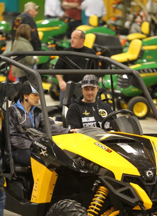 Brandon Sun Andrea McGregor and boyfriend Jason Powers check out a Can-Am all-terrian vehicle, from Action Power, during the opening night of the Brandon Home and Liesure Show being held at the Keystone Centre. (Bruce Bumstead/Brandon Sun)