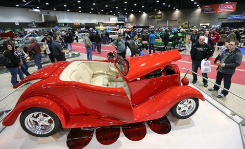 Visitors take a look at Headingley resident Denis Verrier's 1935 Chevrolet Roadster at the 39th annual World of Wheels show at the Winnipeg Convention Centre on Sat., April 6, 2013. The show continues Sunday. Photo by Jason Halstead/Winnipeg Free Press