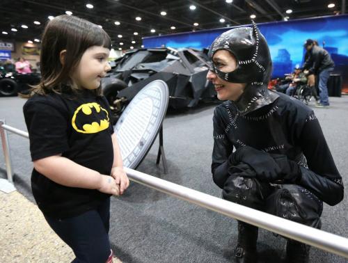 Adeline, 3, meets Catwoman-costumed Marci at the 39th annual World of Wheels show at the Winnipeg Convention Centre on Sat., April 6, 2013. The show continues Sunday. Photo by Jason Halstead/Winnipeg Free Press **MARCI IS A FREE PRESS EMPLOYEE -- DIDN'T WANT LAST NAME USED** **GIRL'S GUARDIAN DIDN'T WANT LAST NAME USED**