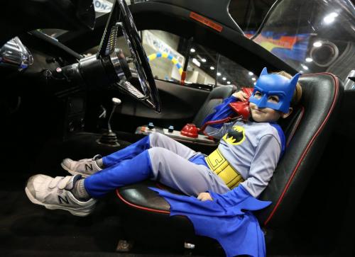 Seth Wray-Jantz, 4, tries out the Bat-phone in a version of the original Batmobile on display at the 39th annual World of Wheels show at the Winnipeg Convention Centre on Sat., April 6, 2013. The show continues Sunday. Photo by Jason Halstead/Winnipeg Free Press