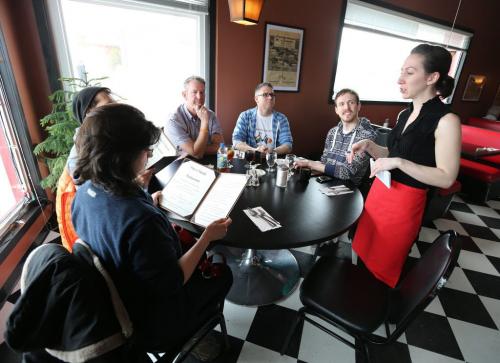 From left, Winnipegger Sylvie Lavallee, Leeadam Engel, Erwin Maguire, Chad Smith and Harrison Oakes give their food orders to Pots N Hands server Beth. Many people from Winnipeg travelled to eat at Pots N Hands restaurant in a show of support on Sat., April 6, 2013, after the owners were subjected to homophobic taunts. The owners are planning to close the eatery for good on April 13. RE: Turner story Photo by Jason Halstead for the Winnipeg Free Press
