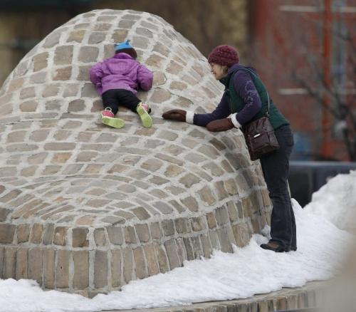 Teagin Arnason, 3, and her mom, Patti Sutherland playing in the Oodena Circle at The Forks, Sunday, April 7, 2013. (TREVOR HAGAN/WINNIPEG FREE PRESS)