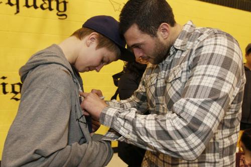 April 7, 2013 - 130407  -  Anthony Peluso signs a shirt for Troy Ternent (13) at a celebration at Norquay Community Centre. Jim Slater and Anthony Peluso surprised some kids from the North End Hockey Project at Norquay Community Centre in Winnipeg Sunday, April 7, 2013. John Woods / Winnipeg Free Press