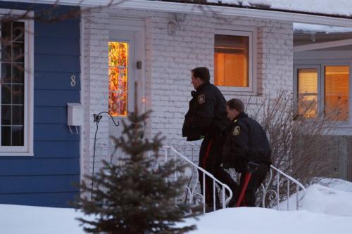 April 7, 2013 - 130407  -  Police enter a home on Weaver Bay where a woman was allegedly stabbed in Winnipeg Sunday, April 7, 2013. John Woods / Winnipeg Free Press