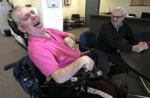 Laurie Beachell- National Coordinator from Council of Canadian with disablities, right, visits with Ron Wall in his Portage Ave office MondaySee Lindor Reynolds story- April 08, 2013   (JOE BRYKSA / WINNIPEG FREE PRESS)