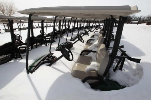 Sitting in Winters Grasp Golf carts still sit in winters grasp at the Tuxedo Golf Course- 400 Shaftesbury Blvd, in Tuxedo in Winnipeg Tuesday- See weather story- April 08, 2013   (JOE BRYKSA / WINNIPEG FREE PRESS)