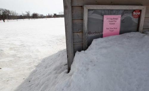 Sitting in Winters Grasp  Driving range hut covered in snow at Tuxedo Golf Course- 400 Shaftesbury Blvd, in Tuxedo in Winnipeg Tuesday- See weather story- April 08, 2013   (JOE BRYKSA / WINNIPEG FREE PRESS)