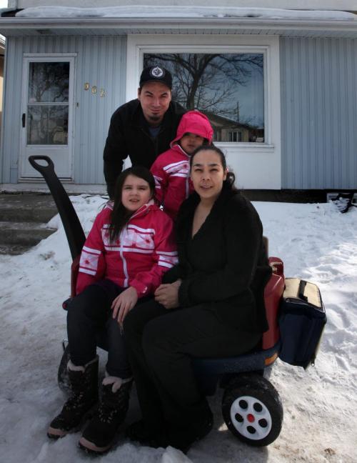 SONYA CHESWORTH and her husband, WILLIAM ANDERSON, and their daughters, ILLYRIA, 6, and JULIETTE, 2. Pose in front of their home Tuesday. They are one of 11 First Nations families who received financial support to help buy their first home under the Manitoba Tipi Mitawa  program. The five-year-old program is a joint partnership between the Manitoba Real Estate Association and the Assembly of Manitoba Chiefs. The programs federal-provincial funding has run out and theyre now looking for new sources of funding to keep the program going. See Murray McNeil's story. April 9, 2013 - (Phil Hossack / Winnipeg Free Press)