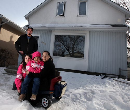 SONYA CHESWORTH and her husband, WILLIAM ANDERSON, and their daughters, ILLYRIA, 6, and JULIETTE, 2. Pose in front of their home Tuesday. They are one of 11 First Nations families who received financial support to help buy their first home under the Manitoba Tipi Mitawa  program. The five-year-old program is a joint partnership between the Manitoba Real Estate Association and the Assembly of Manitoba Chiefs. The programs federal-provincial funding has run out and theyre now looking for new sources of funding to keep the program going. See Murray McNeil's story. April 9, 2013 - (Phil Hossack / Winnipeg Free Press)