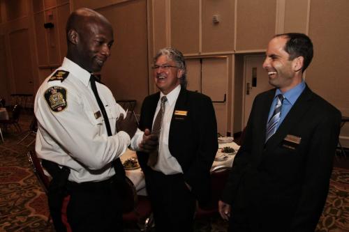Winnipeg's Chief of Police Devon Clunis (left) chats with Darren Klassen (right) chair of BOMA (Building Owners and Managers of Manitoba) and Tom Skraba (centre) before his noon-hour speech at the Delta Hotel where he will be announcing new downtown safety initiatives. This is his first time speaking to members of BOMA the commercial real estate industry in Manitoba. 130410 April 10, 2013 Mike Deal / Winnipeg Free Press