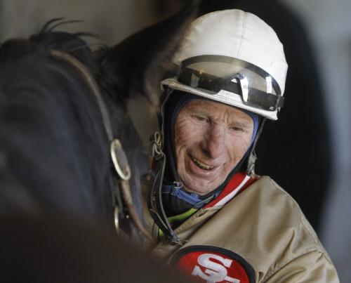Jockey, Jerry Pruitt holds Slipper Sue while she has her feet trimmed in a stable at Assiniboia Downs, Wednesday, April 10, 2013. (TREVOR HAGAN/WINNIPEG FREE PRESS)