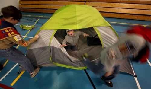 Good Deed Week Cub scouts bubble out of a tent they erected under the direction of a Scout Wednesday evening. The troup is preparing for an early spring camping trip in a couple of weeeks. See Carolin Vesely's story. April 10, 2013 - (Phil Hossack / Winnipeg Free Press)
