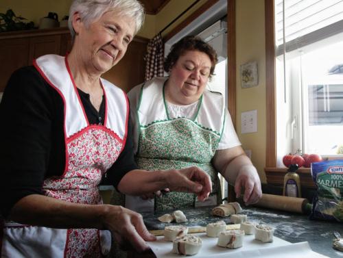 Betty Reimer (left) and Charlotte Penner (right) prepare to put some puff pastry spirals into the oven. The duo created the popular cookbook, Mennonite Girls Can Cook and have just finished a new cookbook, Mennonite Girls Can Cook Celebrations. 130411 April 11, 2013 Mike Deal / Winnipeg Free Press