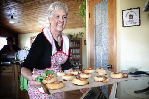 Betty Reimer pulls the puff pastry spirals out of the oven. Betty Reimer and Charlotte Penner created the popular cookbook, Mennonite Girls Can Cook and have just finished a new cookbook, Mennonite Girls Can Cook Celebrations. 130411 April 11, 2013 Mike Deal / Winnipeg Free Press