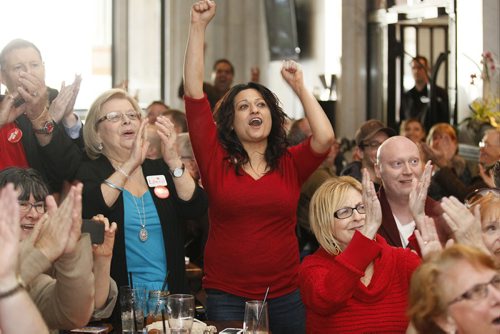 April 14, 2013 - 130414 - Manitoba Liberal party members (L to R) Jean McKenzie, Rana Bokhari and Meryle Lewis celebrate at a Winnipeg pub a Justin Trudeau win in their party's federal leadership race Sunday, April 14, 2013. John Woods / Winnipeg Free Press