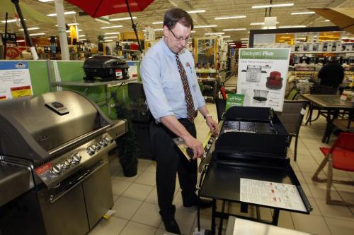 Season Product sales effected by the lingering  winter-  Regent Ave Canadian Tire general Mgr.  Rob Petkau  with BBQ's and other season merchandise  ready to move when the weather warms up .Biz story by Murray McNeill, KEN GIGLIOTTI / April . 15 2013 / WINNIPEG FREE PRESS