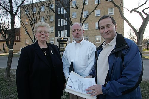 BORIS MINKEVICH / WINNIPEG FREE PRESS  070423 CMHA Carol Hiscock, Manitoba Schizophrenia Society's Chris Summerville, and Winnipeg Harvest's David Northcott pose for a photo in front of Madison House, a boarding house for approx. 80 people with mental health issues.
