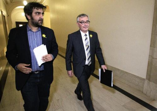 Manitoba's Finance Minister Stan Struthers (right) leaves the media lockup on his way to present the 2013 budget in the Legislative Assembly Tuesday afternoon.  130416 April 16, 2013 Mike Deal / Winnipeg Free Press