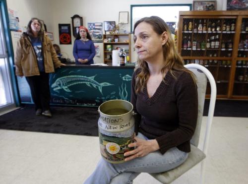 Grocery store owner Angel Calvo  sits with donation jar for roof repairs  , the jar also doubled to collect water dripping throuhgh the cieling- Manitoba Hydro is building a new spillway  and the old company town in closing . People living in company housing have been given notice to leave .  Pointe du Bois 's  75mw plant  is  located on the Winnipeg River  160km NW of Winnipeg  ,generating 599million kWh  from a 14m drop built in 1909  at a cost of $3.5million. It was built with  16 turbine generators ,the first coming into service in 1911 opening .Bill Redekop story