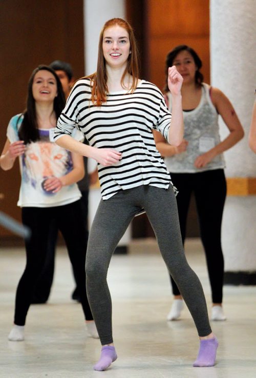 Brandon Sun 16042013 Taylor Lewis of Vincent Massey High School dances with other grade ten students during a Zumba session led by Kathy Grayson at the tenth annual Youth Wellness Day Conference at the Western Manitoba Centennial Auditorium on Tuesday. The conference was put on by the Brandon Suicide Prevention Implementation Network and Youth Revolution. It included a variety of speaker sessions, interactive displays and entertainment and was geared towards all grade ten students in the Brandon School Division.  (Tim Smith/Brandon Sun)