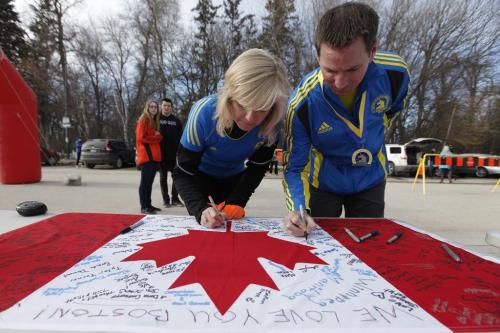 April 16, 2013 - 130416  -  Ramona and Tim Turner joined about 300 people at the Assiniboine Park duckpond for a 5km run and signing of a canadian flag in support of the Boston MArathon victims Tuesday, April 16, 2013. Tim ran the Boston Marathon yesterday. John Woods / Winnipeg Free Press