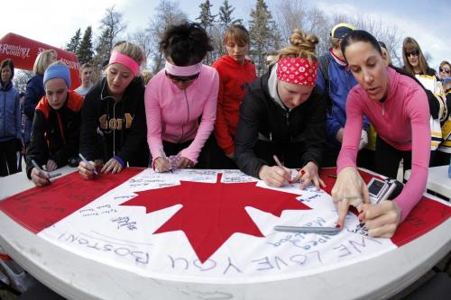 April 16, 2013 - 130416  -  About 300 people gathered at the Assiniboine Park duckpond for a 5km run and the signing of a Canadian flag in support of the Boston Marathon victims Tuesday, April 16, 2013. John Woods / Winnipeg Free Press