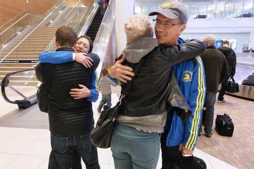 April 16, 2013 - 130416  -  Boston marathoners Vivian Rachlis and David Cormie (R) are greeted by family at the Winnipeg Airport Tuesday, April 16, 2013. John Woods / Winnipeg Free Press