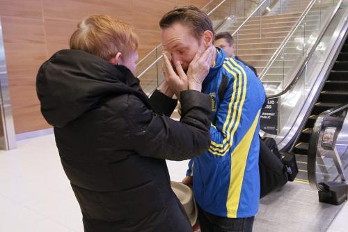 April 16, 2013 - 130416  -  Boston Marathoner Luke Doucet wipes a tear as he greets his mother Margaret Ormond at the Winnipeg Airport Tuesday, April 16, 2013. John Woods / Winnipeg Free Press