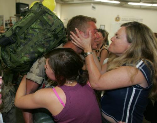 BORIS MINKEVICH / WINNIPEG FREE PRESS  060816 Canadian troops return from Afghanistan in Winnipeg and are greeted by friends and family. Private Paul Skrypnyk is greeted by 10 family members. He is from Winnipeg(St. James). To the right is his aunt Colleen Morrison. The other girl is his sister (back facing).
