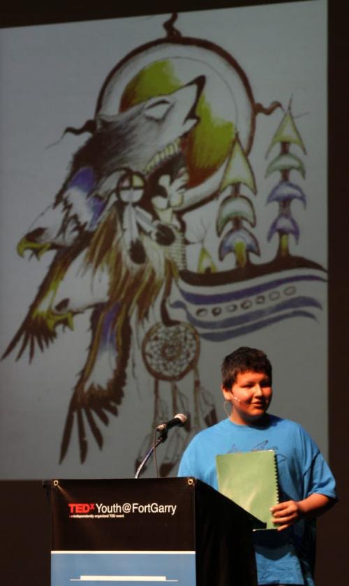 Nick Harper, a 14 year old Cree, Ojibwa artist and a student at  Ecole Stanley Knowles gives a presentation with his art work at the TEDxYouth@FortGarry event held at the Manitoba Theatre for Young People Wednesday. Their website says TEDxYouth@FortGarry is a local, independently organized event that features young adults speaking about their ideas/projects that have brought forth change in their communities.Cindy Chan story (WAYNE GLOWACKI/WINNIPEG FREE PRESS) Winnipeg Free Press April 17 2013